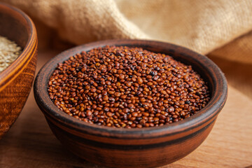 Close-up of Red Quinoa Grains in a Rustic Bowl