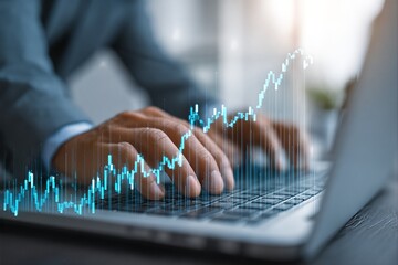 Businessman Analyzing Financial Data on Laptop with Stock Market Graph and Economic Trends