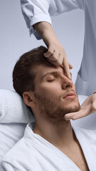 Doctor examining male nasal bridge and profile balance for rhinoplasty planning. Concept of dorsal...