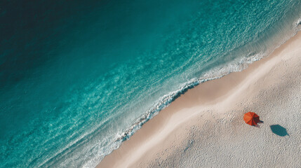 Fototapeta premium Aerial shot of turquoise sea meeting white sand beach 