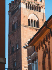 Torrazzo bell tower close up in Cremona, Lombardy, Italy, showing historical architecture and building details