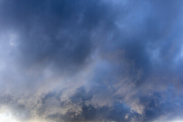 Darkening clouds in soft evening light