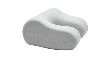 A contoured, white, U-shaped pillow, isolated on a black background, suggesting comfort and travel