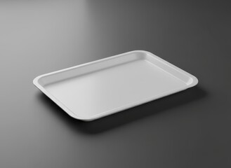 A simple white empty food tray on a dark matte surface