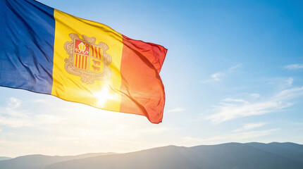 Andorra's flag proudly waves in the wind, showcasing vibrant colors against a picturesque mountain sunset, ideal for tourism and travel themes.