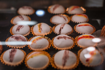 Lots of little white Japanese dessert mochi, delicious tasty snack on the cafe counter