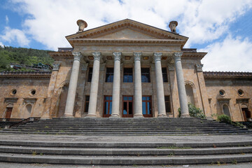 Fototapeta premium The facade of the abandoned Winter Theater (Gagra cinema) on a May day. Gagra, Abkhazia