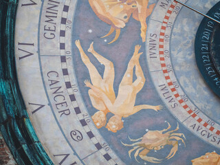 Torrazzo astronomical clock dial displaying zodiac signs Gemini and Cancer, astrology and time...
