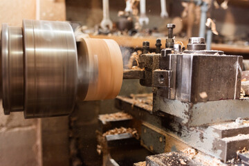 Woodworking Lathe Shaping Wood With Metal Tools In Workshop Carpentry Equipment For Wood Turning And Woodworking.