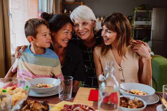 Multi-generational family enjoying a meal together at home