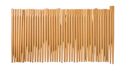 A close-up, overhead view of many vertical, wooden dowels arranged closely together