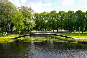 Obraz premium Pedestrian bridge in the moat of Pärnu in the west of Estonia in the Baltic States