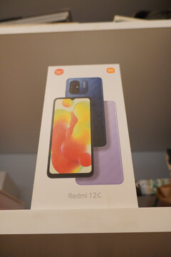 Xiaomi Redmi 12C smartphone box on a shelf, showcasing the phone's design.