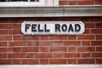 Obraz premium Croydon town in South London, UK. Street name sign for Fell Road.