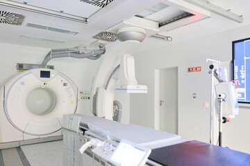 Modern medical imaging room equipped with advanced CT scanner and examination table for patient care