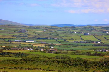 Obraz premium Rural scenery in County Antrim, Northern Ireland. Summer agricultural landscape of Northern Ireland.