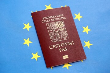 Czech biometrical passport on European Union flag background. Concept of citizenship of Czech Republic