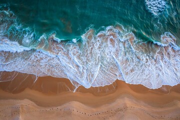Aerial View of Waves Breaking on Sandy Beach