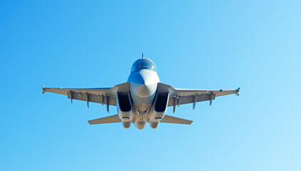 A military fighter jet in the blue sky