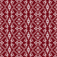 A repeating pattern of white geometric shapes on a rich burgundy background, creating a visually striking textile design.