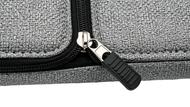 Close-up of a gray fabric bag with a black zipper pull, partially unzipped