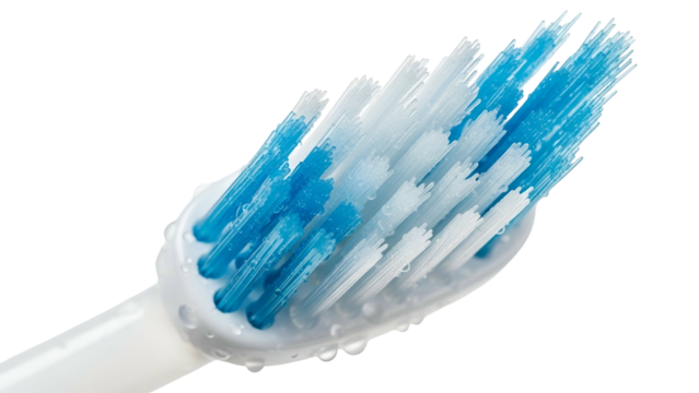 Extreme closeup of a toothbrush head with blue and white bristles against a black background