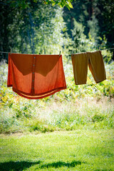 freshly washed clothes hanging in the sun for air drying