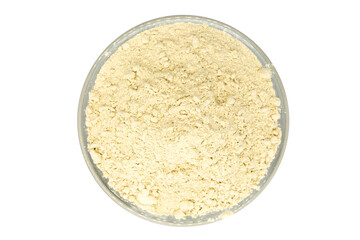 Yellow cosmetic clay in bowl - topview
