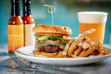 Cheeseburger with grilled pineapple and fries.