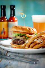 Cheeseburger with grilled pineapple and fries.