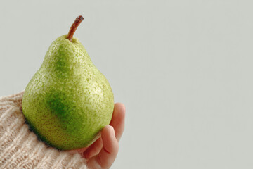 Green Pear in Hand – Natural Food, Minimalist Composition
