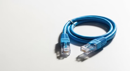 Blue network cable against white background providing fast technology связи. Cable connectors transmit data. Concept technology связи, for digital communications.