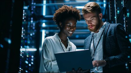 Digital Insight: Tech specialists collaborate in a server room, using a laptop amidst the glow of data centers, showcasing teamwork and technological prowess. - Powered by Adobe