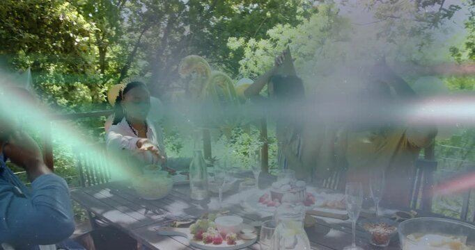 Woman in pink handing gift, friends opening and donning hats, toasting birthday under 30 balloon