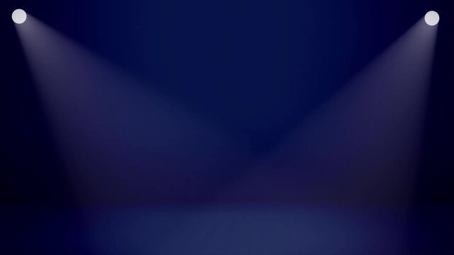 Blue spotlight glowing on a dark stage backdrop