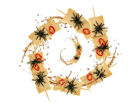 Mid-air odeng skewers with steaming broth splash, floating peppers, and seaweed flakes on a minimal bright backdrop for dynamic food photography