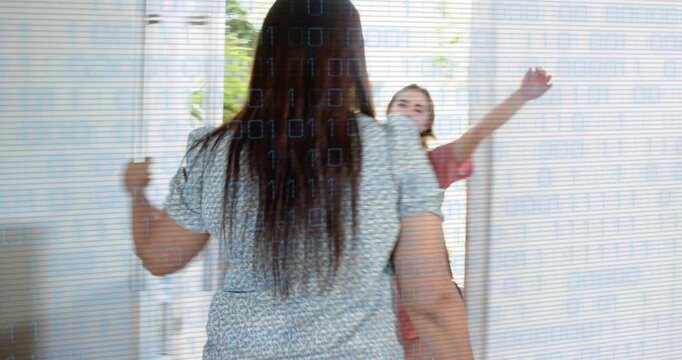 Host peering through peep opening door as visitor holding baby arriving, greeting in home foyer