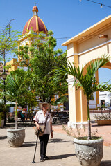 Senior travel. Senior woman at the beautiful heritage town of Mompox wearing the traditional Sombrero vueltiao.