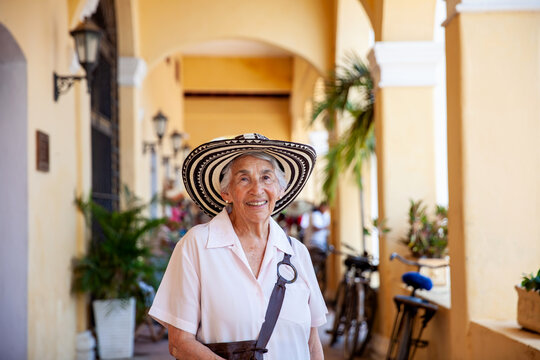 Senior travel. Senior woman at the beautiful heritage town of Mompox wearing the traditional Sombrero vueltiao.