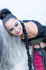 Charming European lady posing with a majestic white horse in an open field, symbolizing freedom, calmness, and connection with nature.