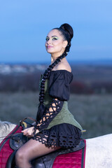 Charming European lady posing with a majestic white horse in an open field, symbolizing freedom, calmness, and connection with nature.