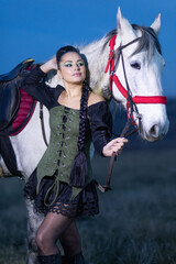 Charming European lady posing with a majestic white horse in an open field, symbolizing freedom, calmness, and connection with nature.