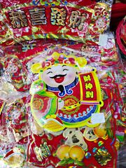 Fototapeta premium Chinese New Year decorations featuring the God of Wealth (Caishen). Translate : The God of Wealth Arrives, May you be happy and prosperous.