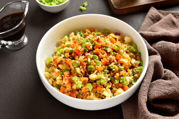 Asian style cauliflower fried rice with carrot, green pea, corn, scrambled eggs