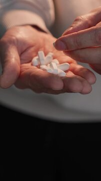 A man holding many medical capsules.
A supplement for the body in cases of poisoning and pain.
Medicinal tablets and an antibacterial agent.