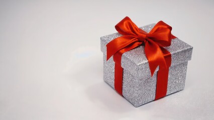  Christmas gift box with a red ribbon