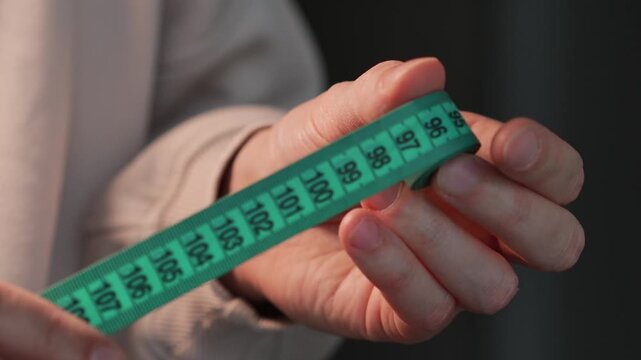Markings with centimeters and decimeters on a measuring tape