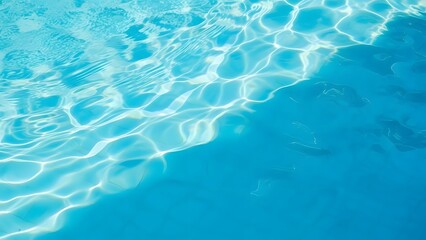 Obraz premium Clear Blue Swimming Pool Water Surface with Sunlight Reflections