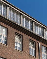 facade of an older brick building with windows