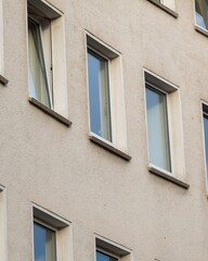 rows of windows on an older residential building